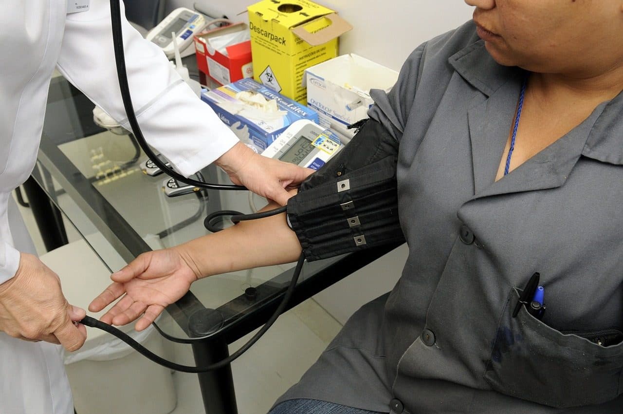 A blood pressure cuff being used during a checkup