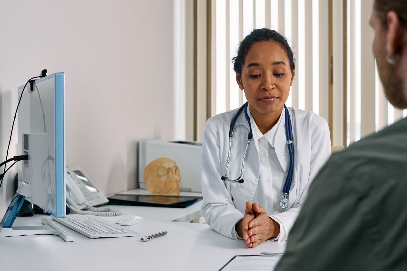 A patient counting the cost of care, illustrating transparent monthly pricing